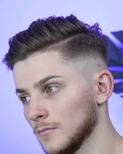 Side profile showing a low skin fade blending into natural hair