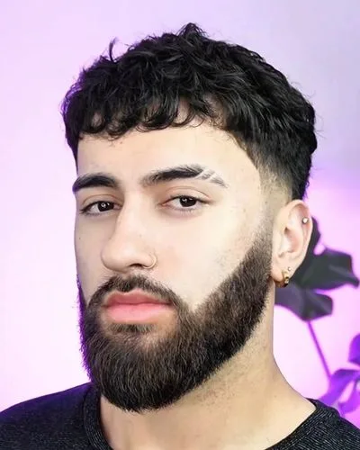 Taper fade paired with a shaped beard — full finished look